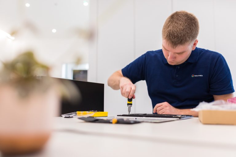 IT Engineer fixing laptop